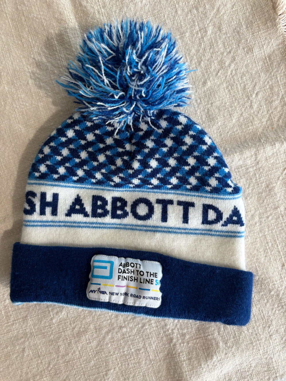 NYRR New Balance Blue and White Pom Pom Knit Beanie